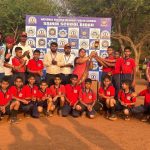 Students of Sainik School Bidar celebrating a sports victory with a trophy.